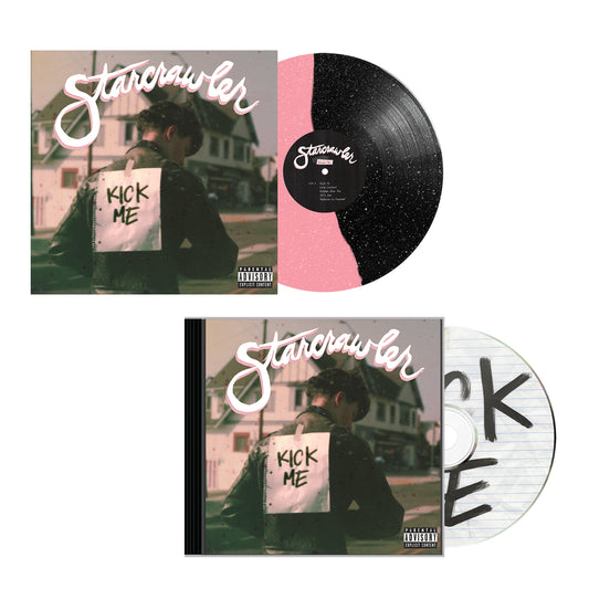 A signed Starcrawlers KICK ME album presented as a vinyl record with a split pink and black design, and as a CD with a lined notebook-style disc.