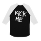 Black and white Tultex baseball-style three-quarter sleeve shirt featuring custom apparel with the words KICK ME written in white paint-stroke lettering on the back.