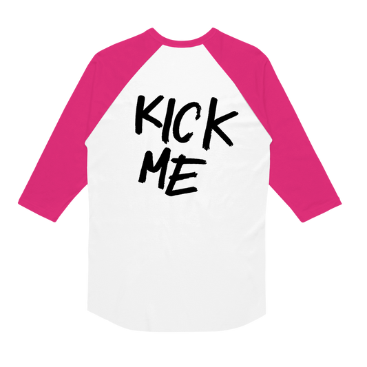 White Gildan baseball shirt with pink three-quarter sleeves and the words KICK ME printed in black text on the chest.
